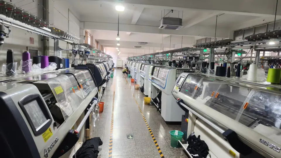 Rows of computerized knitting machines during garment production