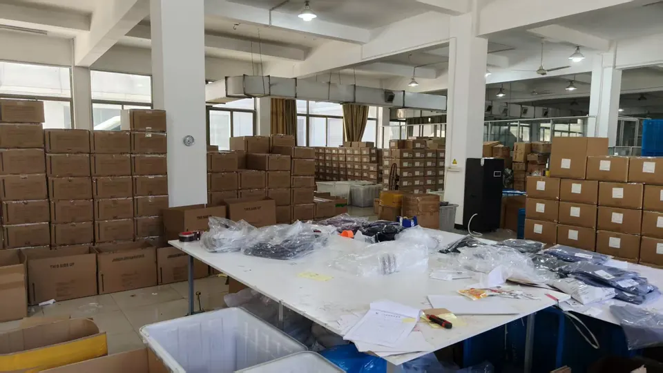Packed export cartons and bagged garments in the finished-goods area