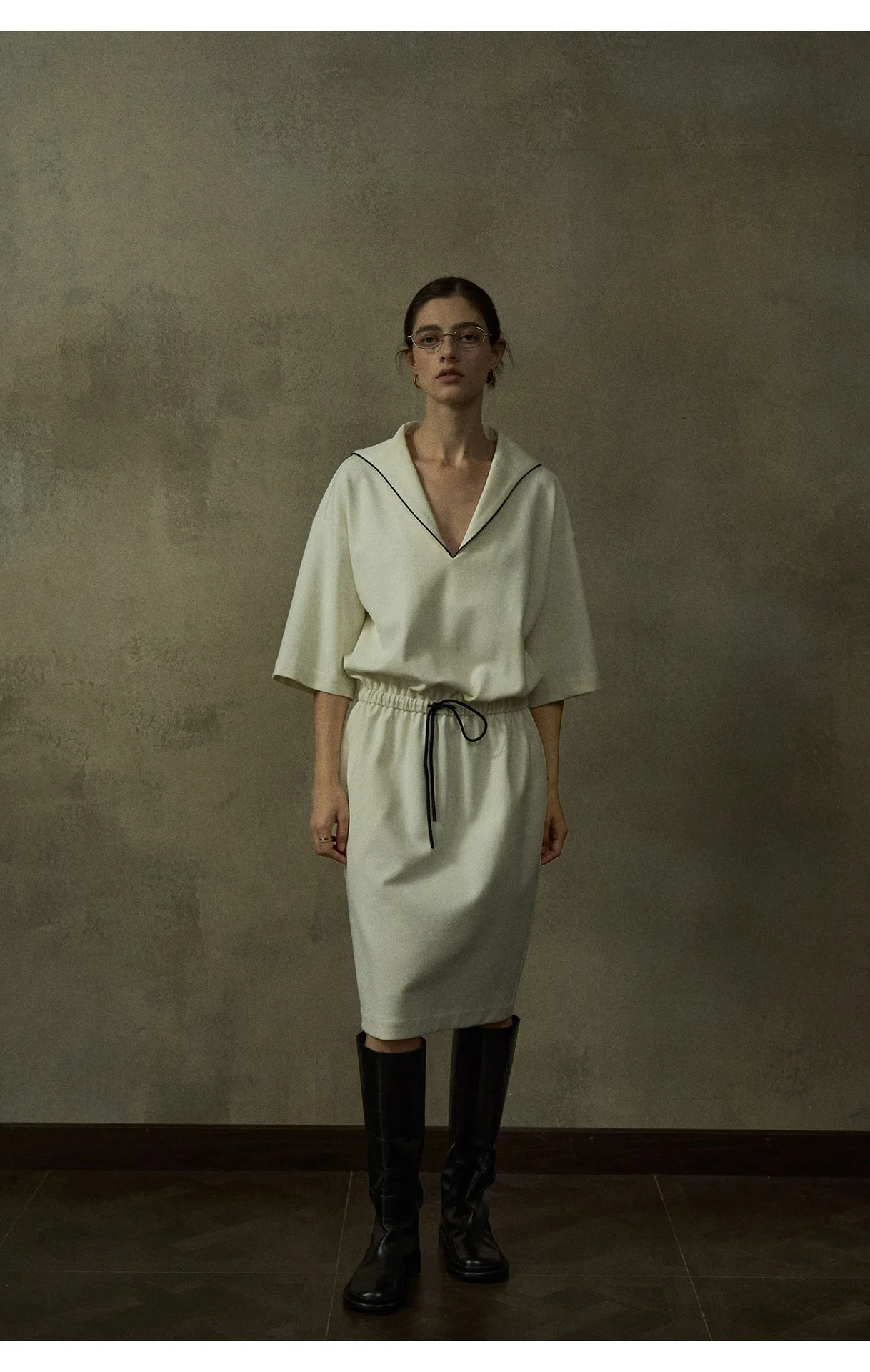 Woman wearing a light color-block V-neck textured twill midi dress