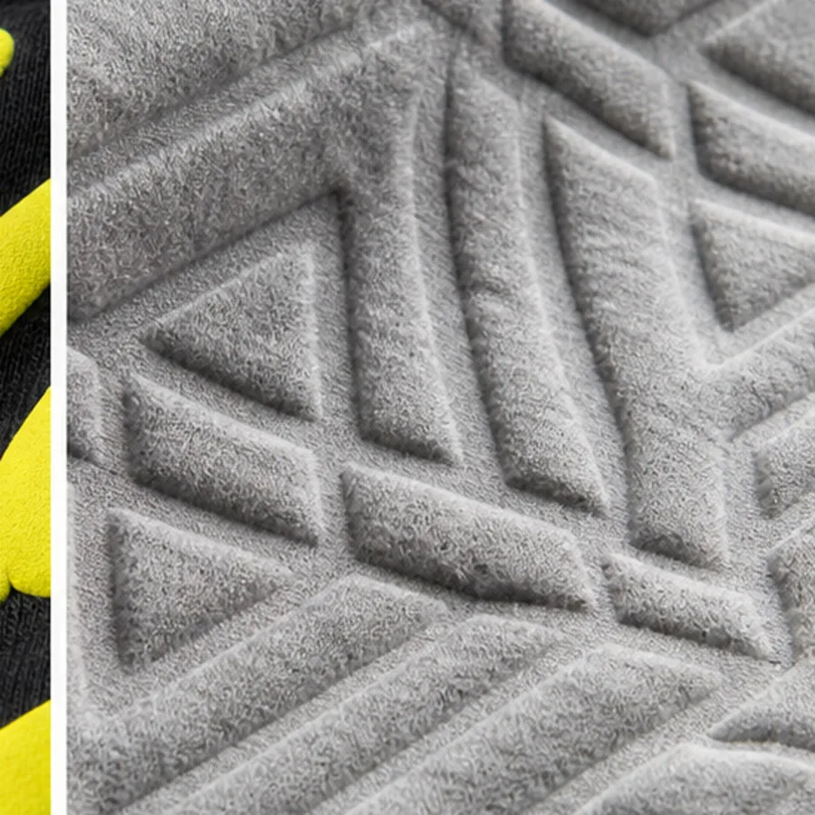 Monochrome embossed relief pattern on gray sweatshirt fabric