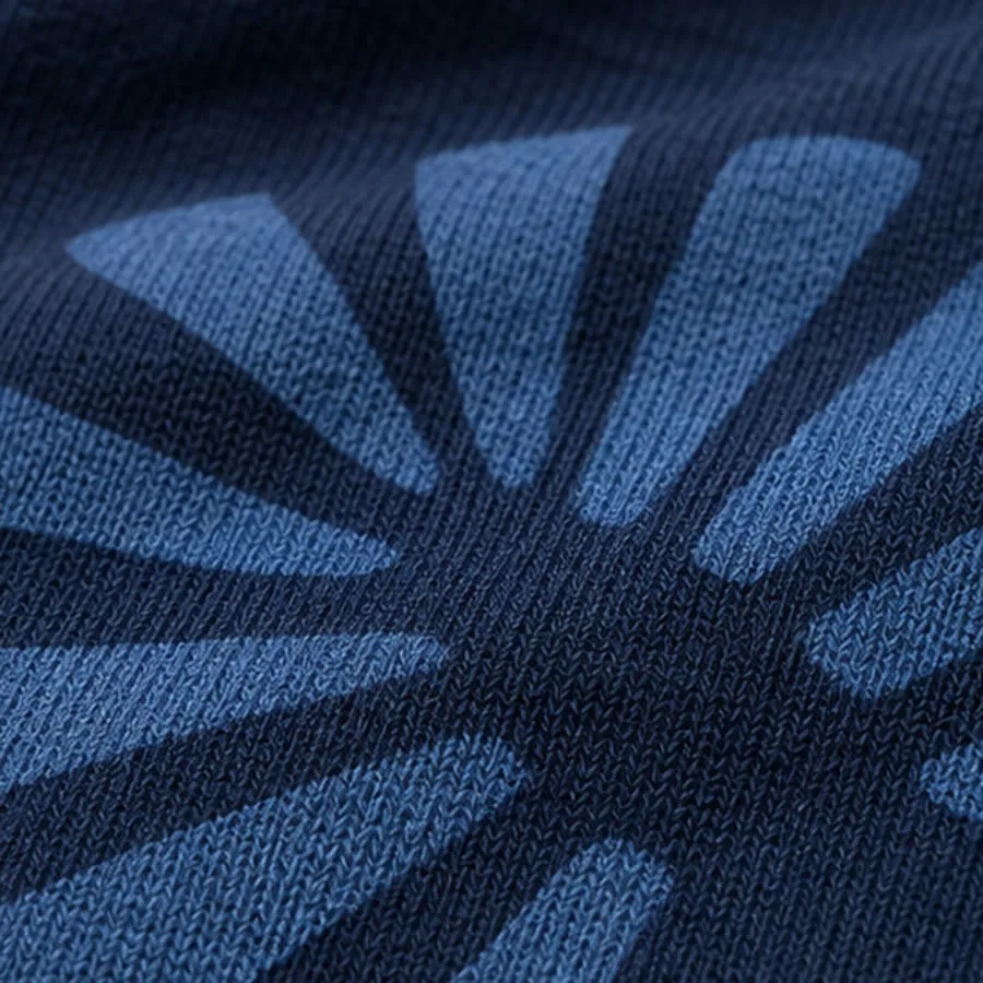Water-based print absorbed into navy cotton jersey